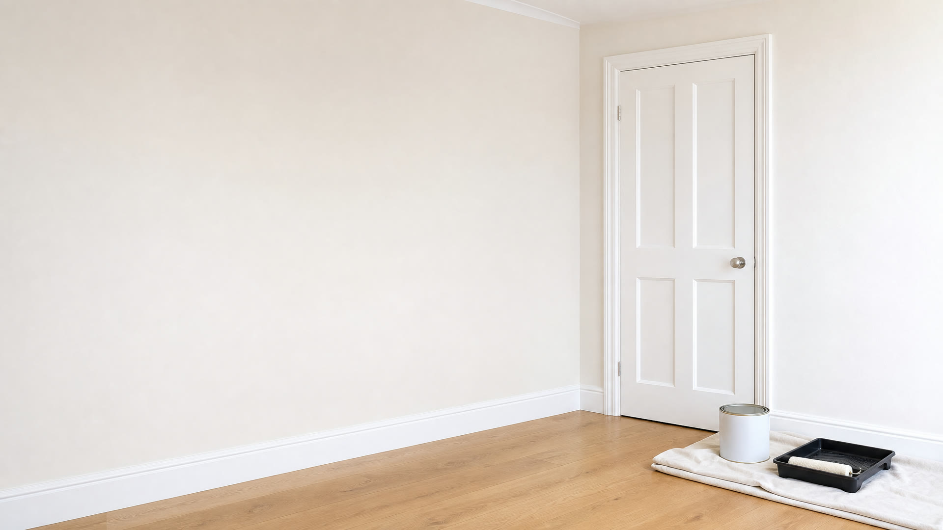Freshly painted room with paint tin and roller tray